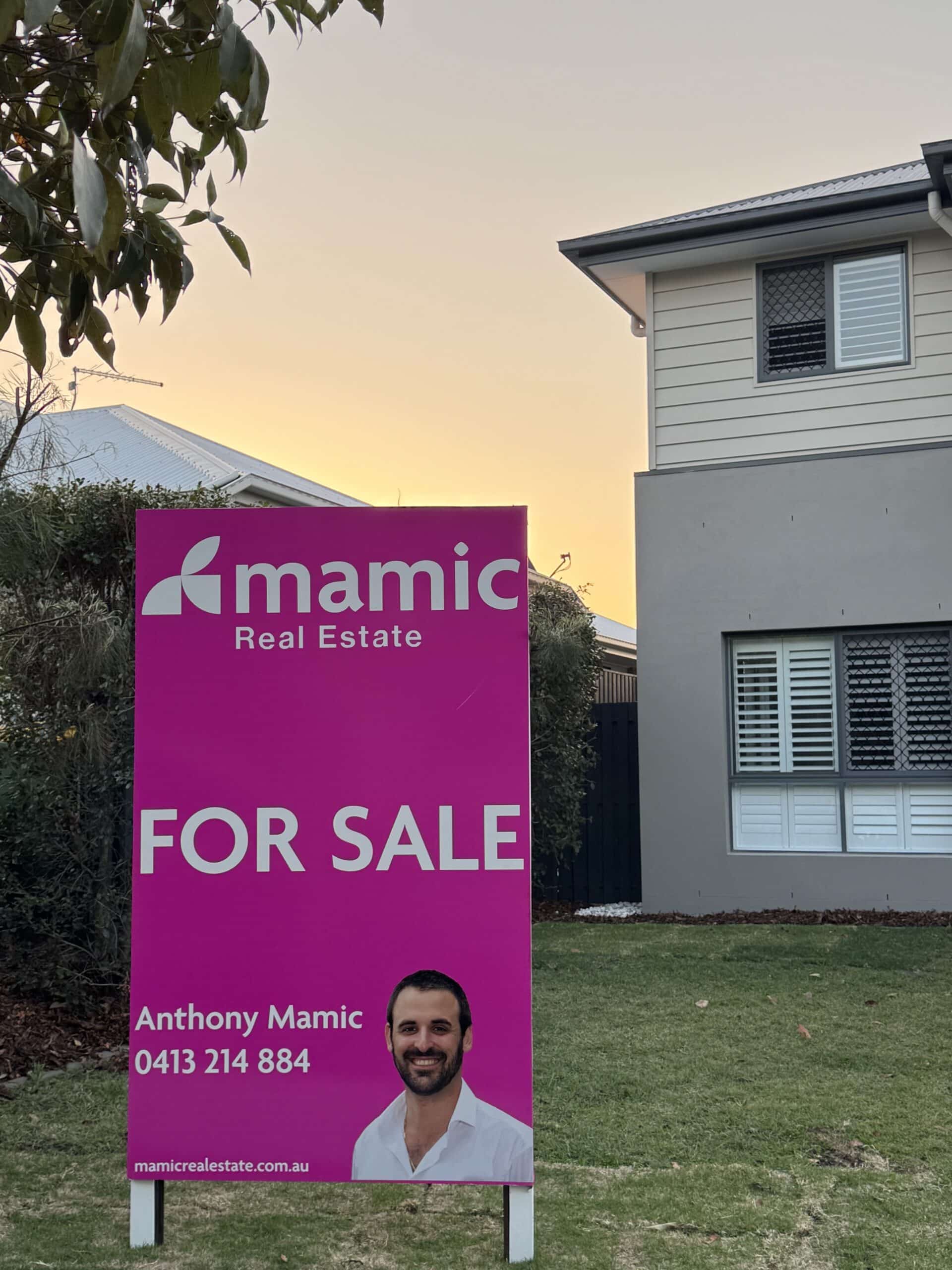 Mamic Real Estate for sale signboard